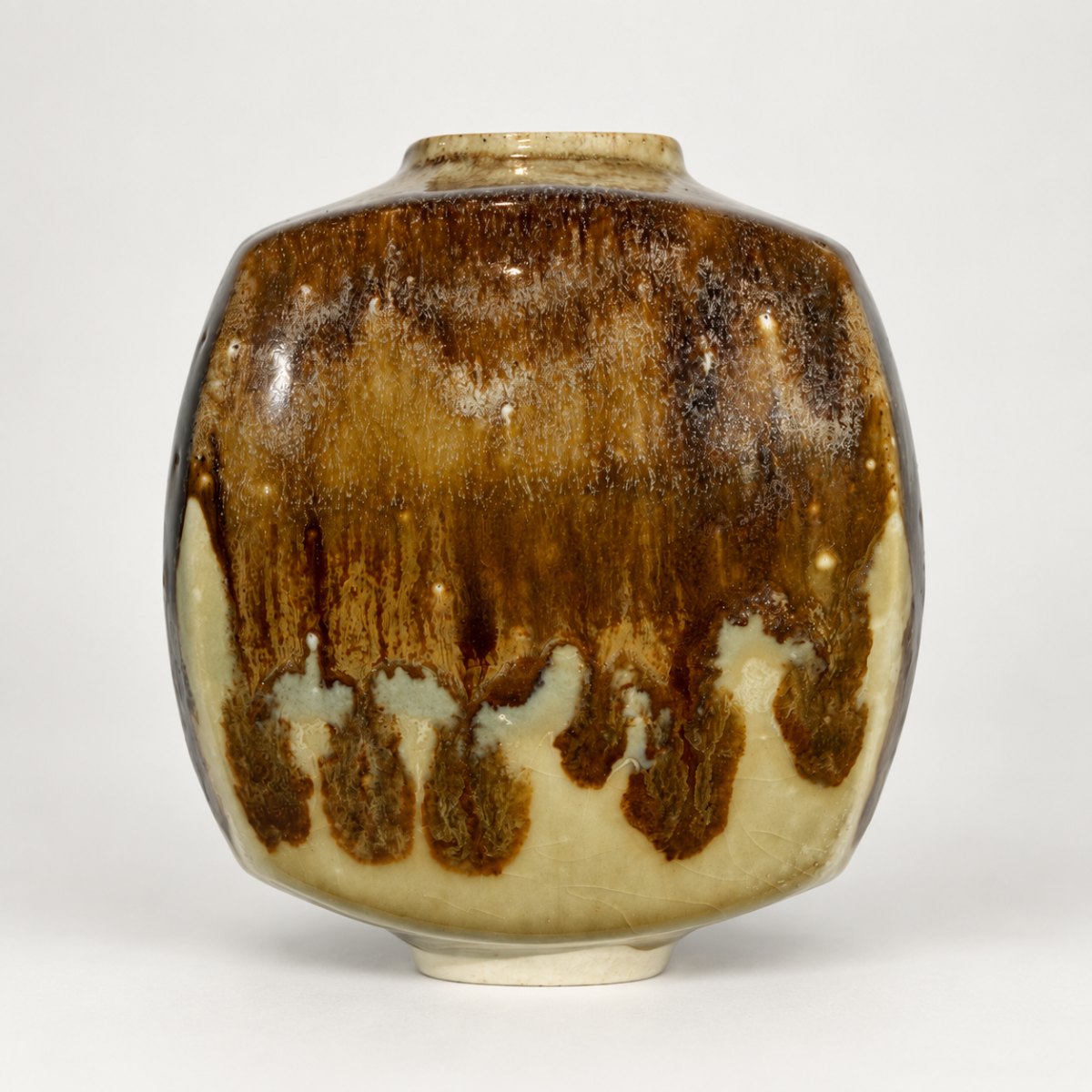 Slipcast form, cream base with iron-brown drips