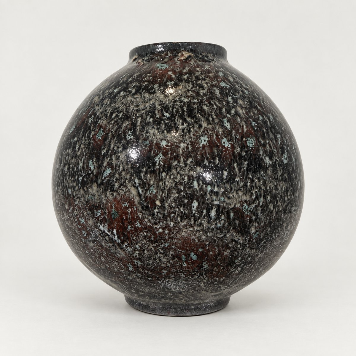 Moon jar, black and oxblood mottle flecked with white and turquoise